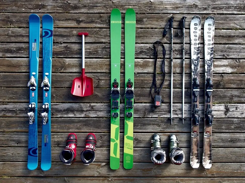 A complete ski kit with skis, boots, and poles.