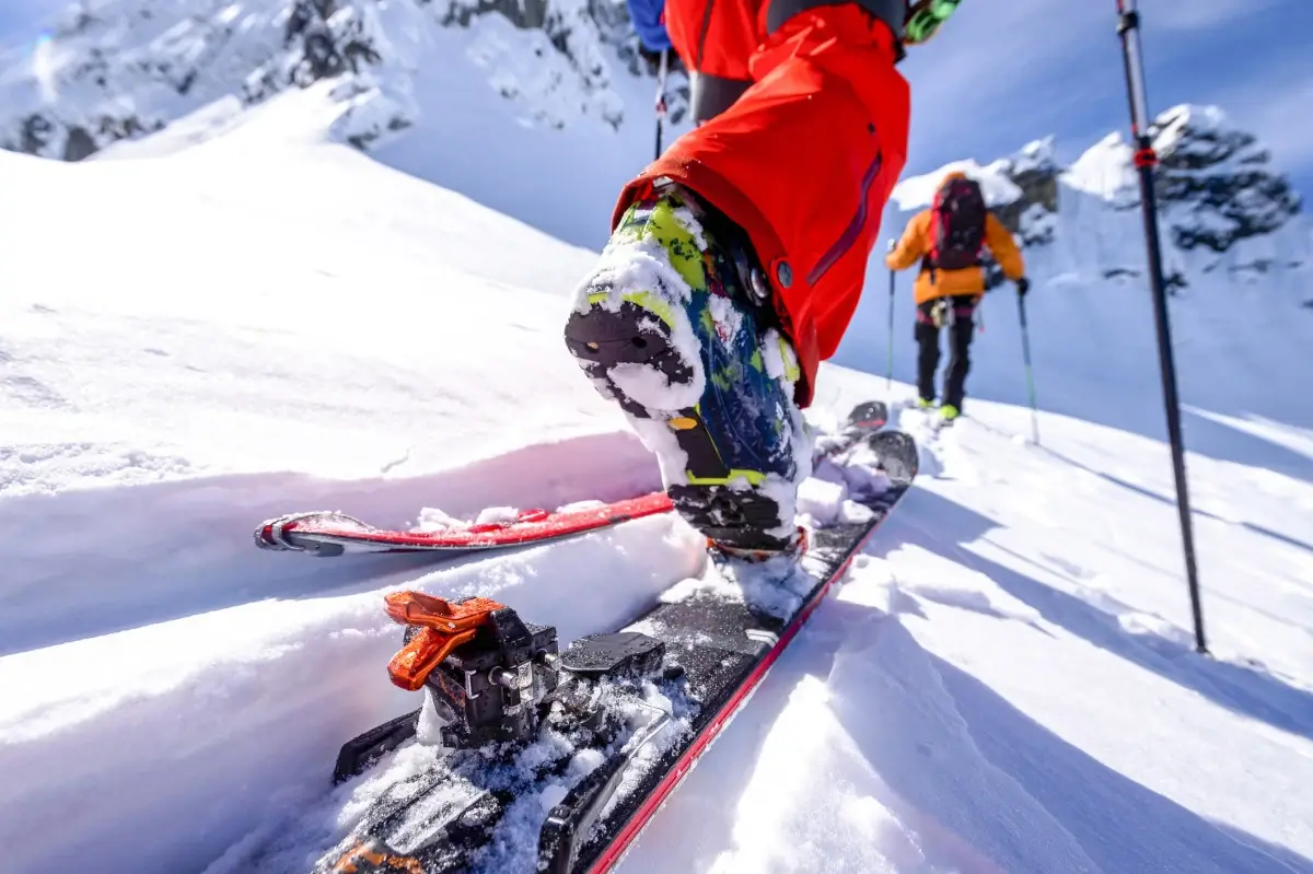 Skier making fresh tracks on an untouched slope.